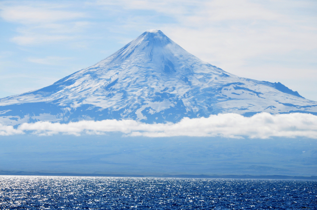 A telescopic view of Shishaldin Volcano from the Bering Sea