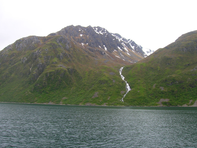 A waterfall rushing to the sea on Kodiak Island