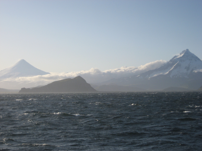 Isanotski on the right and Shishaldin on the left on a hazy day