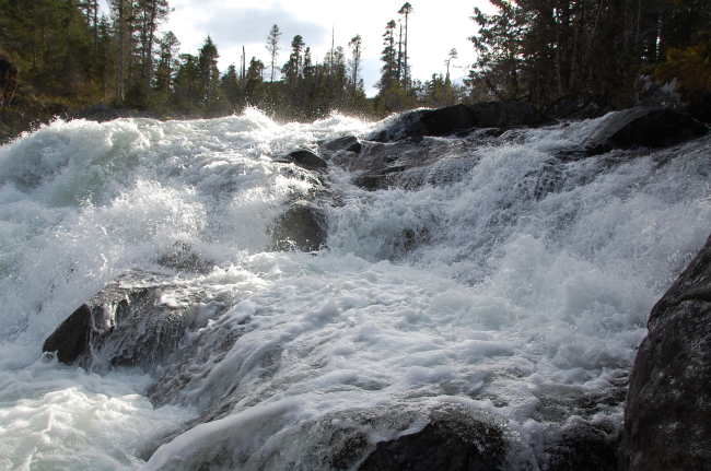 Baranof River waterfalls as they enter Warm Springs Bay