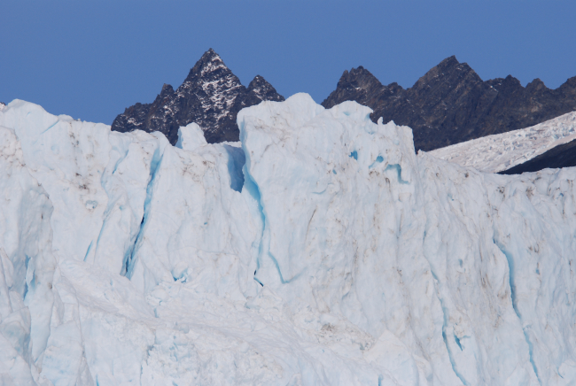 Mountain peaks behind Aialik Glacier  front