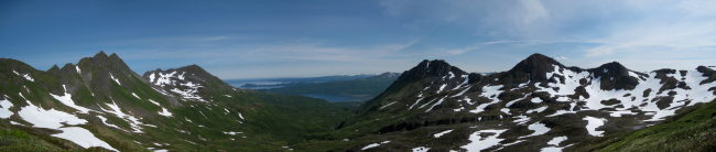 A mountain panorama looking down to the sea