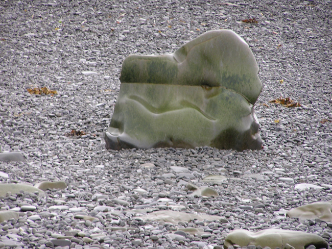 A smoothly eroded small boulder on a Shumagin Island pebble beach